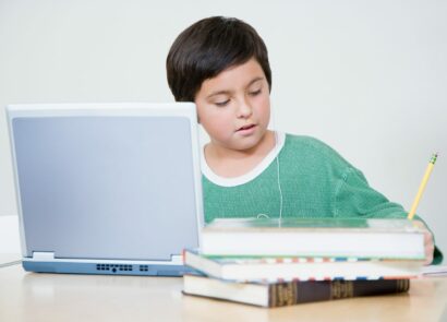 Kid doing homework at computer