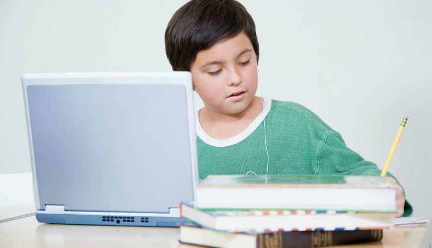 Kid doing homework at computer